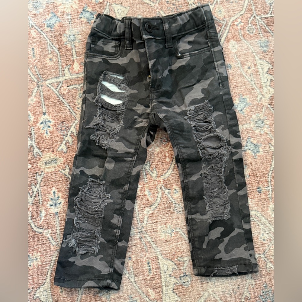 Hand distressed dark camo jeans
